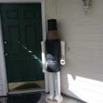 Raw nutcracker in his Christmas home spot, made of PVC pipe and PVC planters.