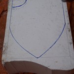 Four inch block getting ready to carve Skull Knight from Berserk shield.