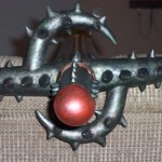 Top view of Skull Knight sword showing double half round thorns not part of main mold.