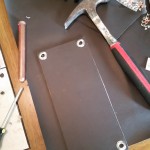 Double layer of pleather with cardboard between for stiffness and grommets for strapping