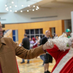 Funny shot taken at Holiday Matsuri 2018 of Howard Langston Cosplay from Jingle All the Way vs Santa; Photographed by TKirk Photos