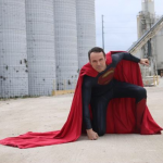 Superman Cosplay, landing or taking off classic pose