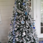 Seven and a half foot snow flocked Christmas Tree decorated