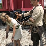 Steampunk father and windup doll daughter